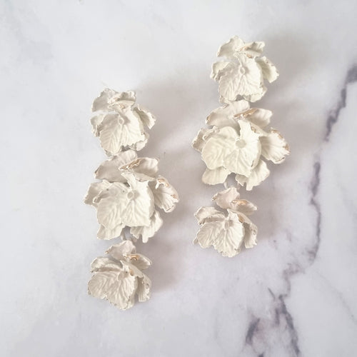 AP219 ARETES FLORES CON FLORES