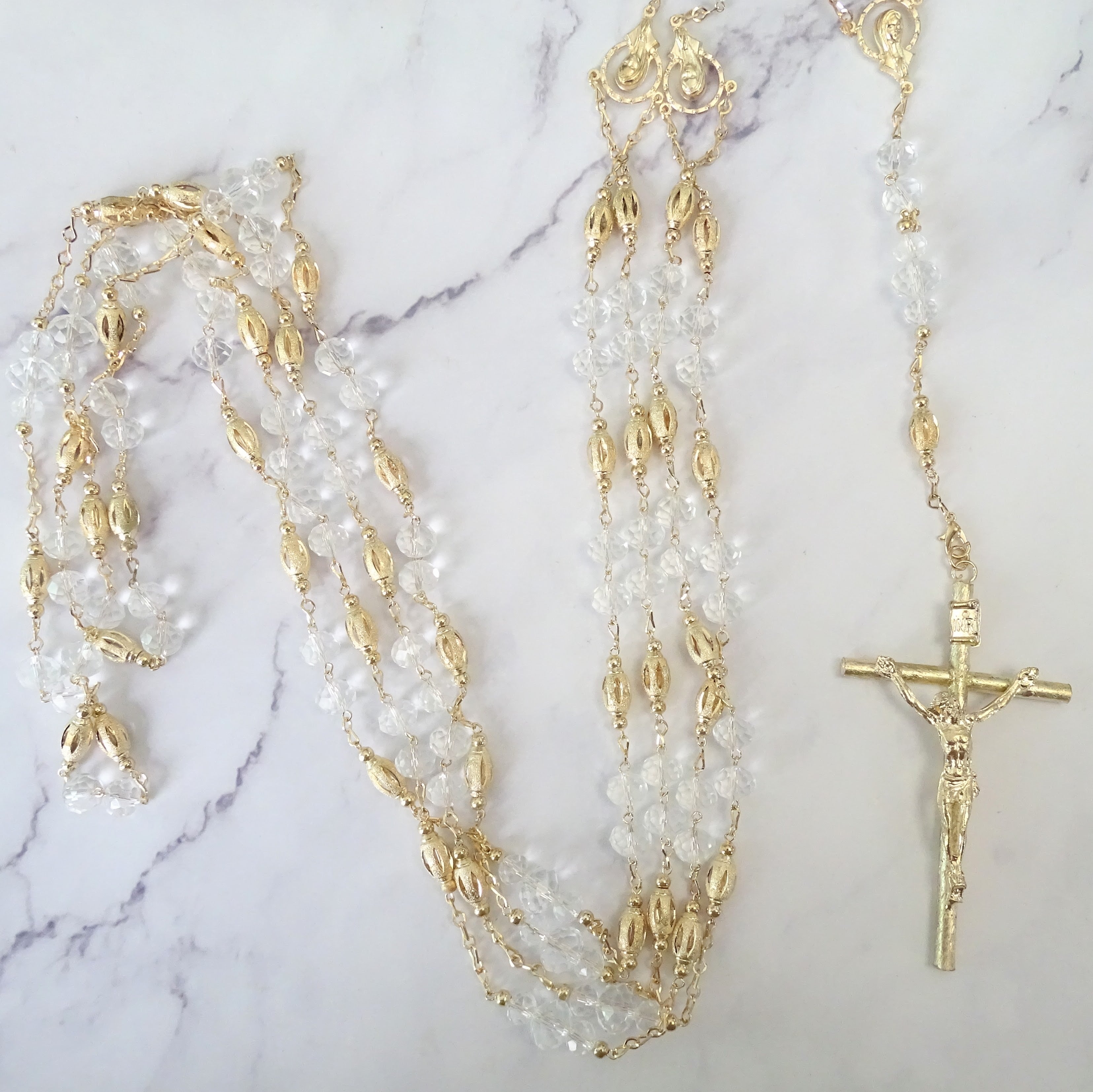 LD142 Lazo Chapa de Oro Crist con Semilla