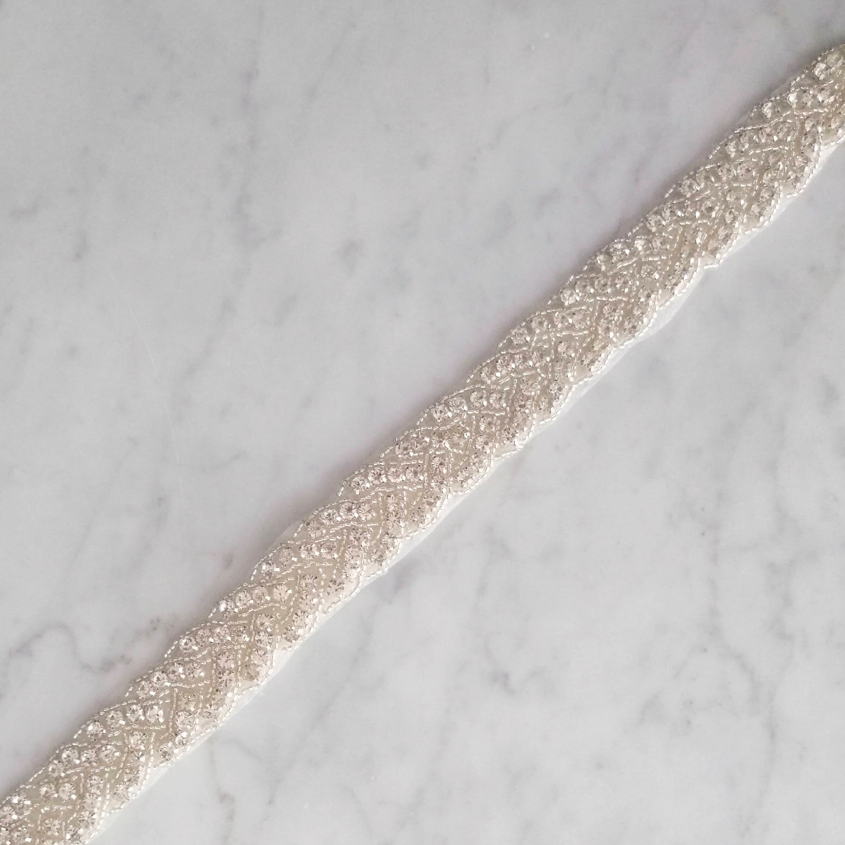 CPI357 CINTO PLATEADO IVORY TRENZADO