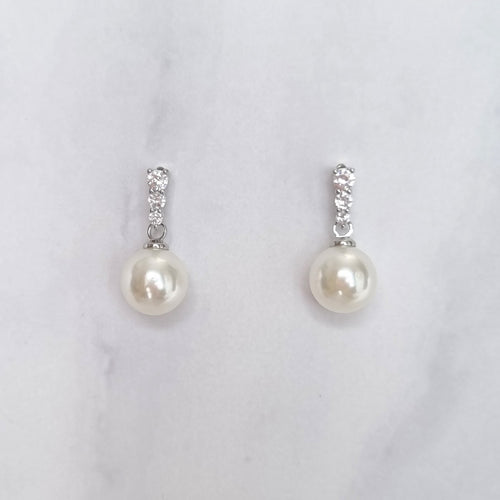 AP165 Aretes Plateados Pal Crist y Perla