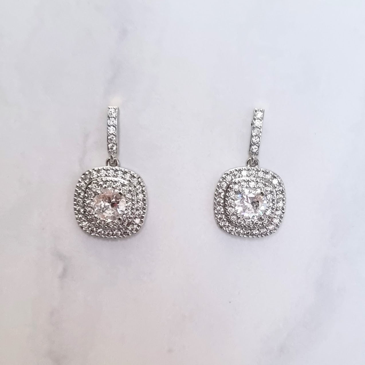 AP407 ARETES PLATA CUAD ORILLA REDONDA