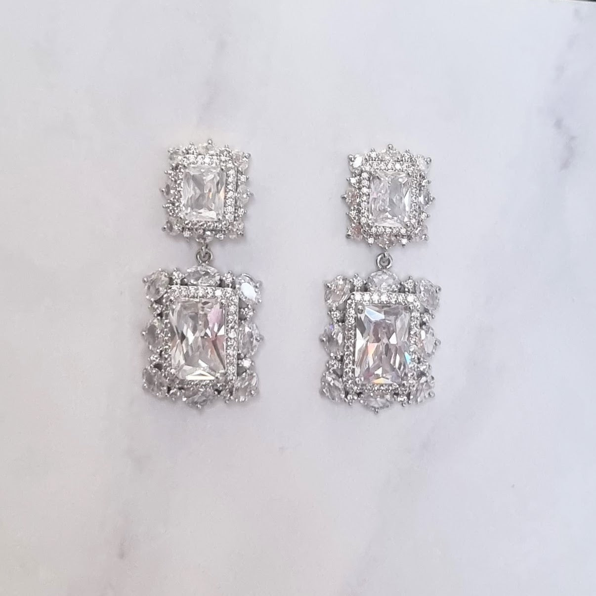 AP186 ARETES PLATEADOS RECTANGULOS MARCO