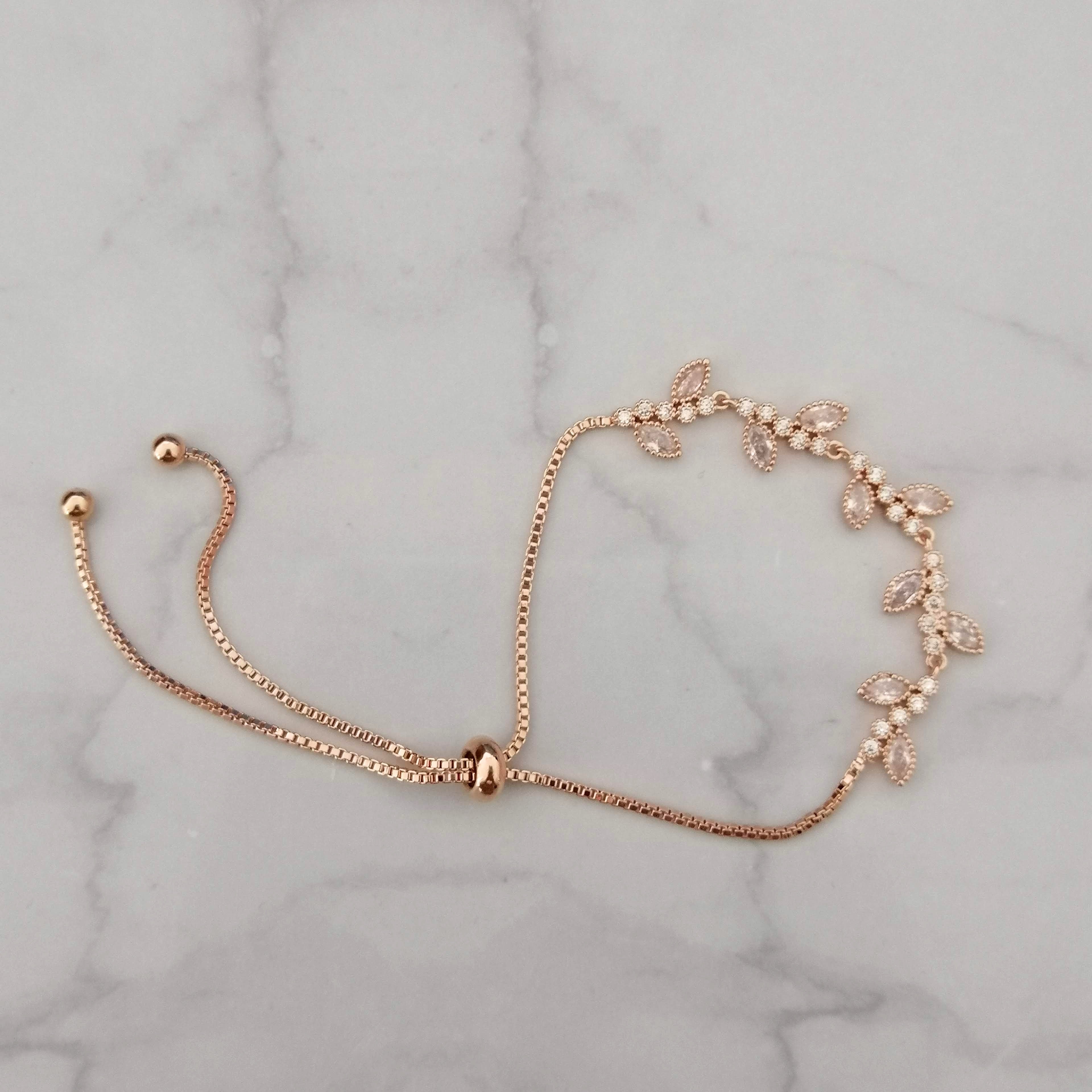 PR687 PULSERA ORO ROSA AJUST RAMITAS PLANA