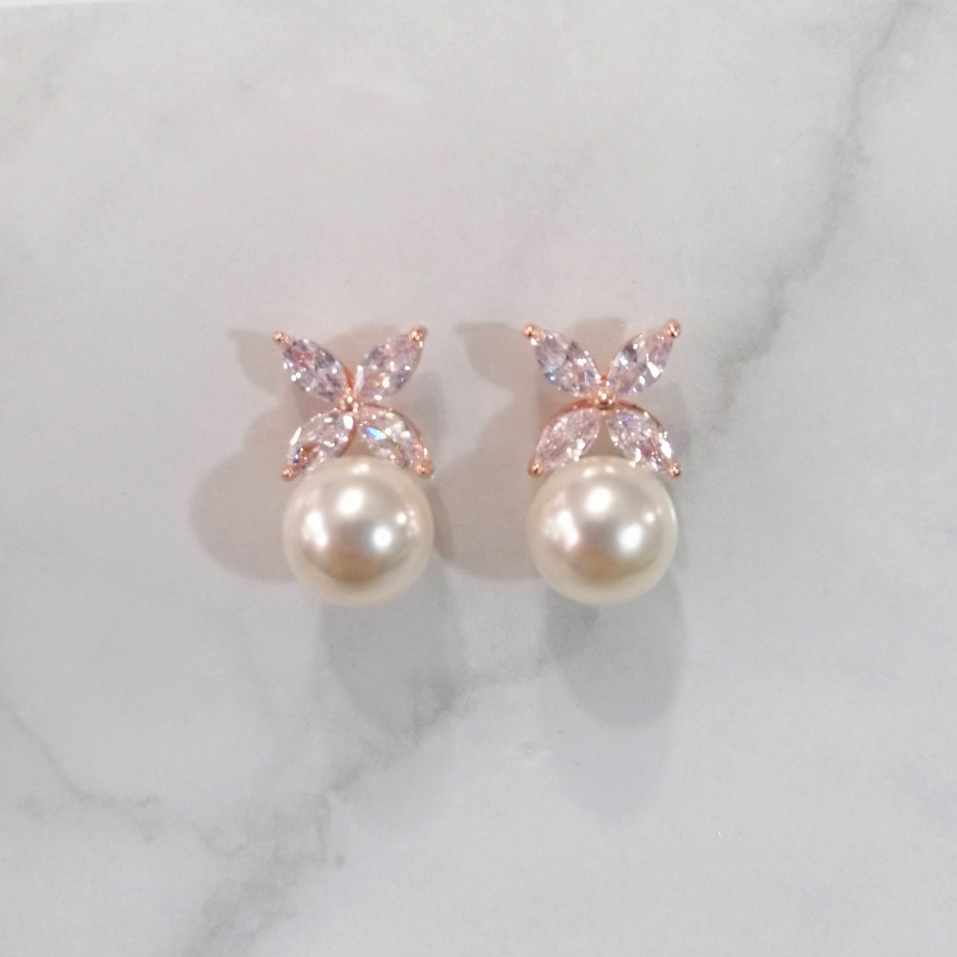 AR852 ARETES ROSAS PERLA CON X