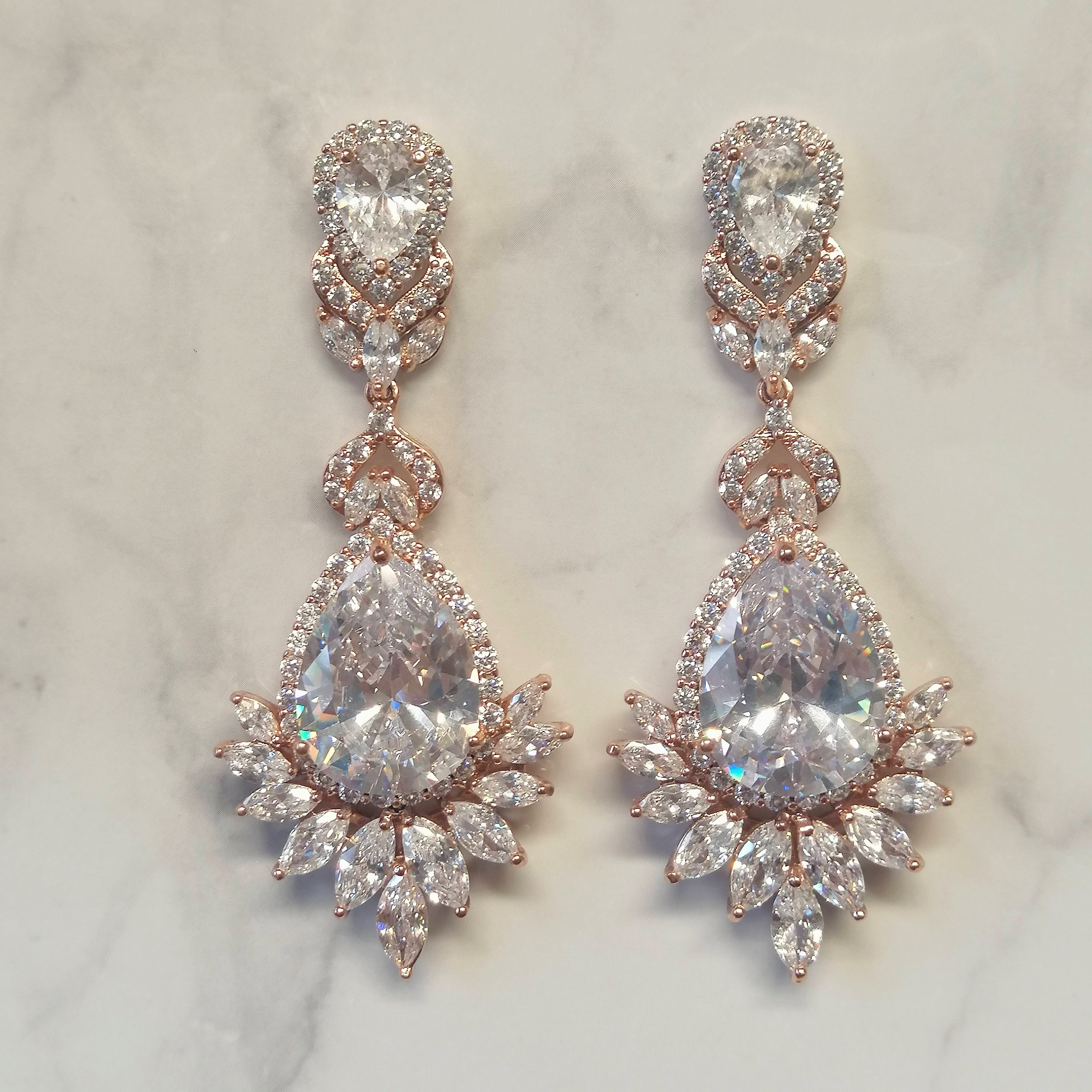 AR125 ARETES ROSA LARGOS GOTA Y MARQ